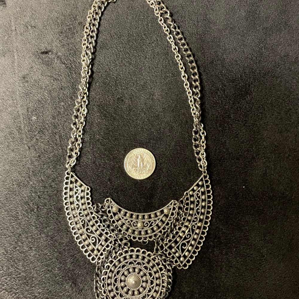 Silver necklace reminiscent of Xena warrior princess